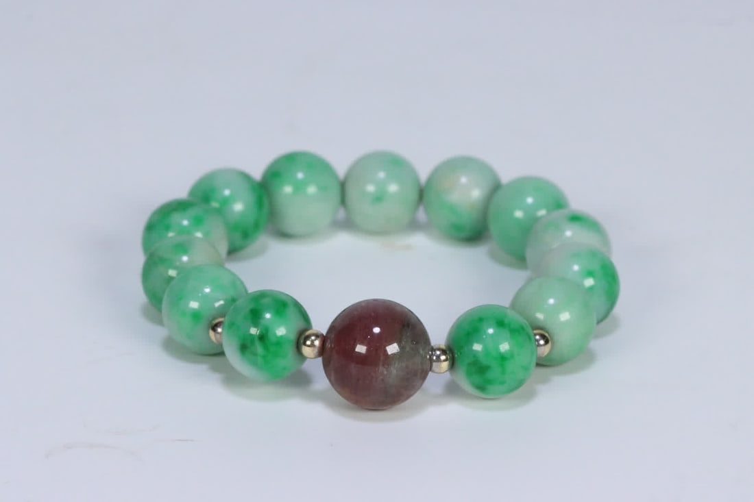 A Qing Dynasty tourmaline bead-separated old jadeite women's bracelet: Qing Dynasty tourmaline bead-separated old jadeite ladies' bracelet SIZE: 1.2cm W:45.8g (The Dimensions Of All Batches Are Manually Measured.If You Need More Detailed Information, Please Contact Our