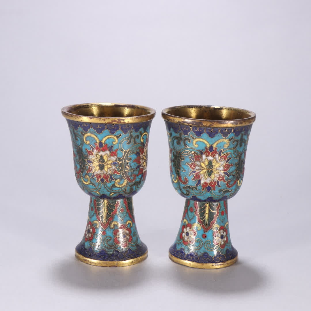 A pair of Qing Dynasty copper gilt cloisonne wine cups with entwined lotus patterns: A pair of Qing dynasty copper gilt cloisonne wine cups with entwined lotus patterns SIZE: H:8.9cm W:5.5cm Total W:358.3g (The Dimensions Of All Batches Are Manually Measured.If You Need More Detailed