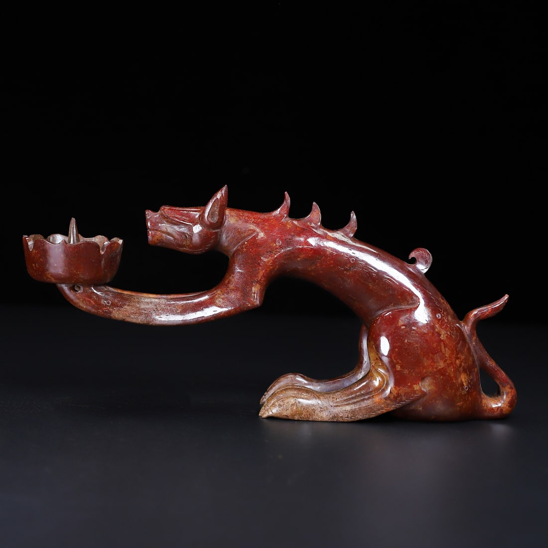 An Exquisite White Jade Auspicious Beast-Shaped Candlestick: An Exquisite White Jade Auspicious Beast-Shaped Candlestick Han Dynasty, China Size:25.2cmx11cmx5.8cm Weight:837g (The Dimensions Of All Batches Are Manually Measured.If You Need More Detailed