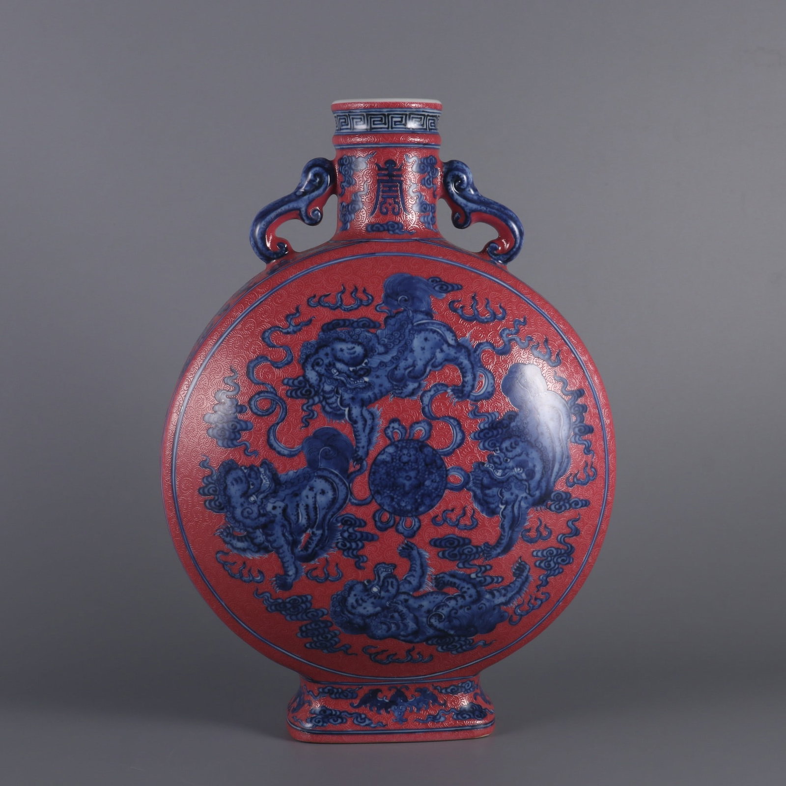 An Exquisite Blue and White Ruby Red-Glazed Lion Pattern Bats and Peach Pattern Double-Ears Vase: An Exquisite Blue and White Ruby Red-Glazed Lion Pattern Bats and Peach Pattern Double-Ears Vase Qing Dynasty, China Qianlong Six-character Mark Size:32.8cmx22.5cm (The Dimensions Of All Batches Are