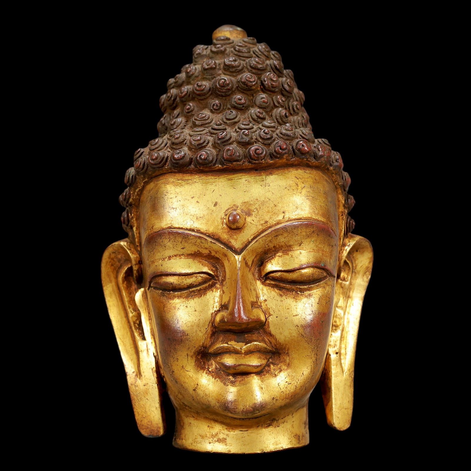A Exquisite Gilt Bronze Buddha head: A Exquisite Gilt Bronze Buddha head Qing Dynasty, China Size:13cmx12cmx20cm Weight:1850g (The Dimensions Of All Batches Are Manually Measured.If You Need More Detailed Information, Please Contact Our