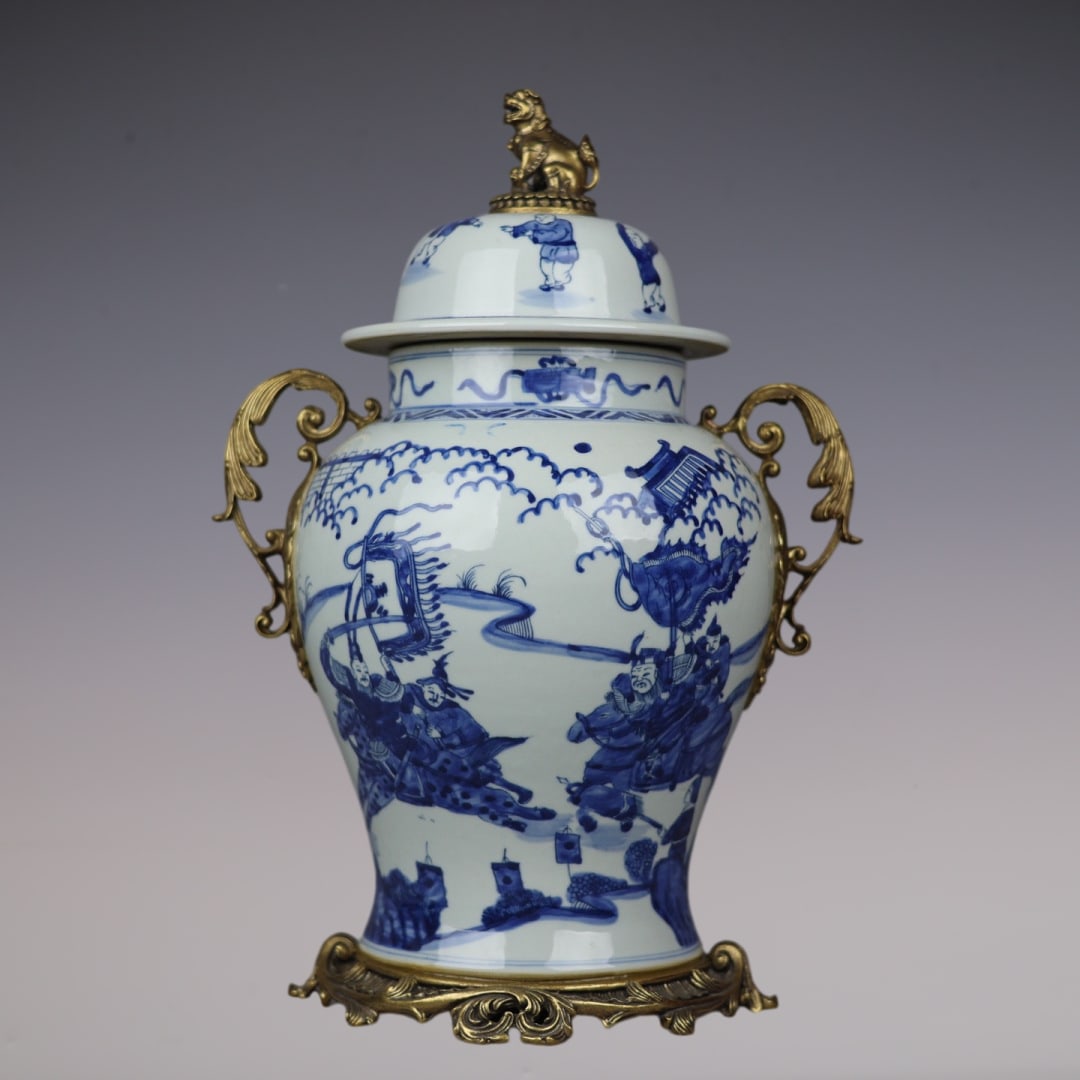 An Exquisite Blue and White Inlaid Bronze Character and Story Pattern Double-Ears Jar: An Exquisite Blue and White Inlaid Bronze Character and Story Pattern Double-Ears Jar Qing Dynasty, China Kangxi Six-character Mark Size:42cmx27cm (The Dimensions Of All Batches Are Manually