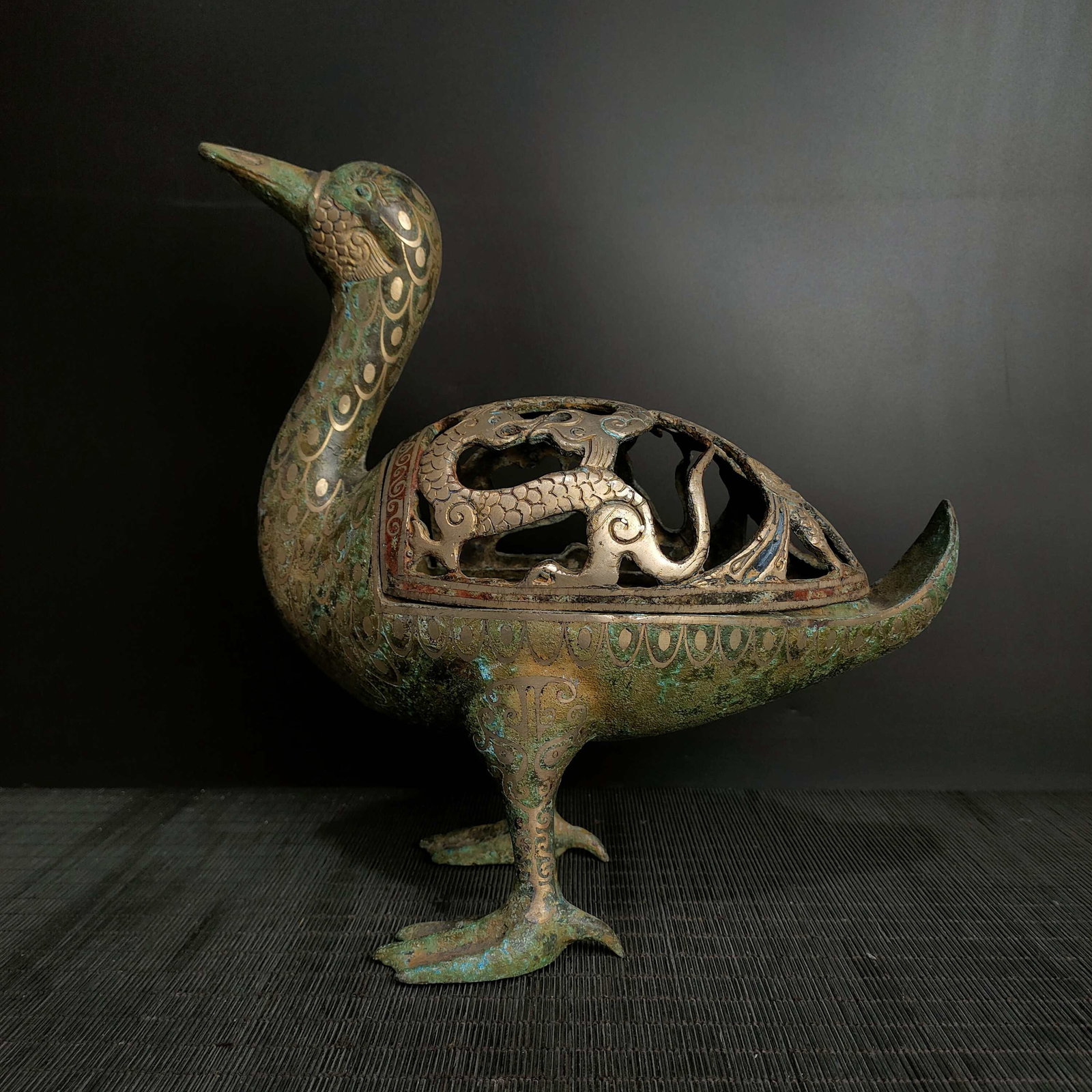 An Exquisite Bronze Inlaid Silver Dunk-Shaped Censer: An Exquisite Bronze Inlaid Silver Dunk-Shaped Censer the Warring States period in China Size:28cmx28cm Weight:2.1kg (The Dimensions Of All Batches Are Manually Measured.If You Need More Detailed