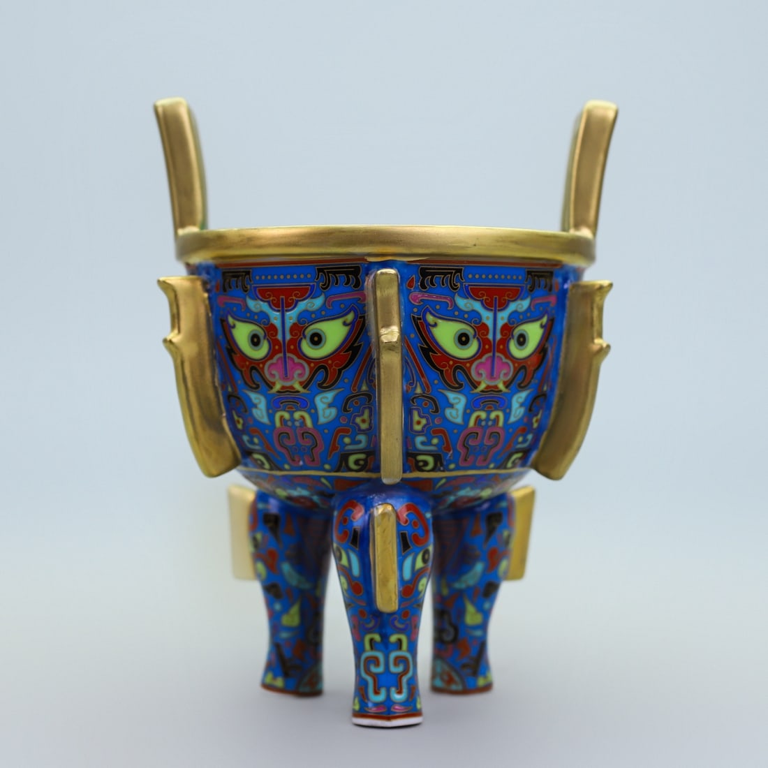 An Exquisite Famille-Rose Inlaid Gilt Bronze Beast-Face Pattern Double-Ears and Tripod Censer: An Exquisite Famille-Rose Inlaid Gilt Bronze Beast-Face Pattern Double-Ears and Tripod Censer Qing Dynasty, China Qianlong Four-character Mark Size:15cmx12cm Weight:420g (The Dimensions Of All