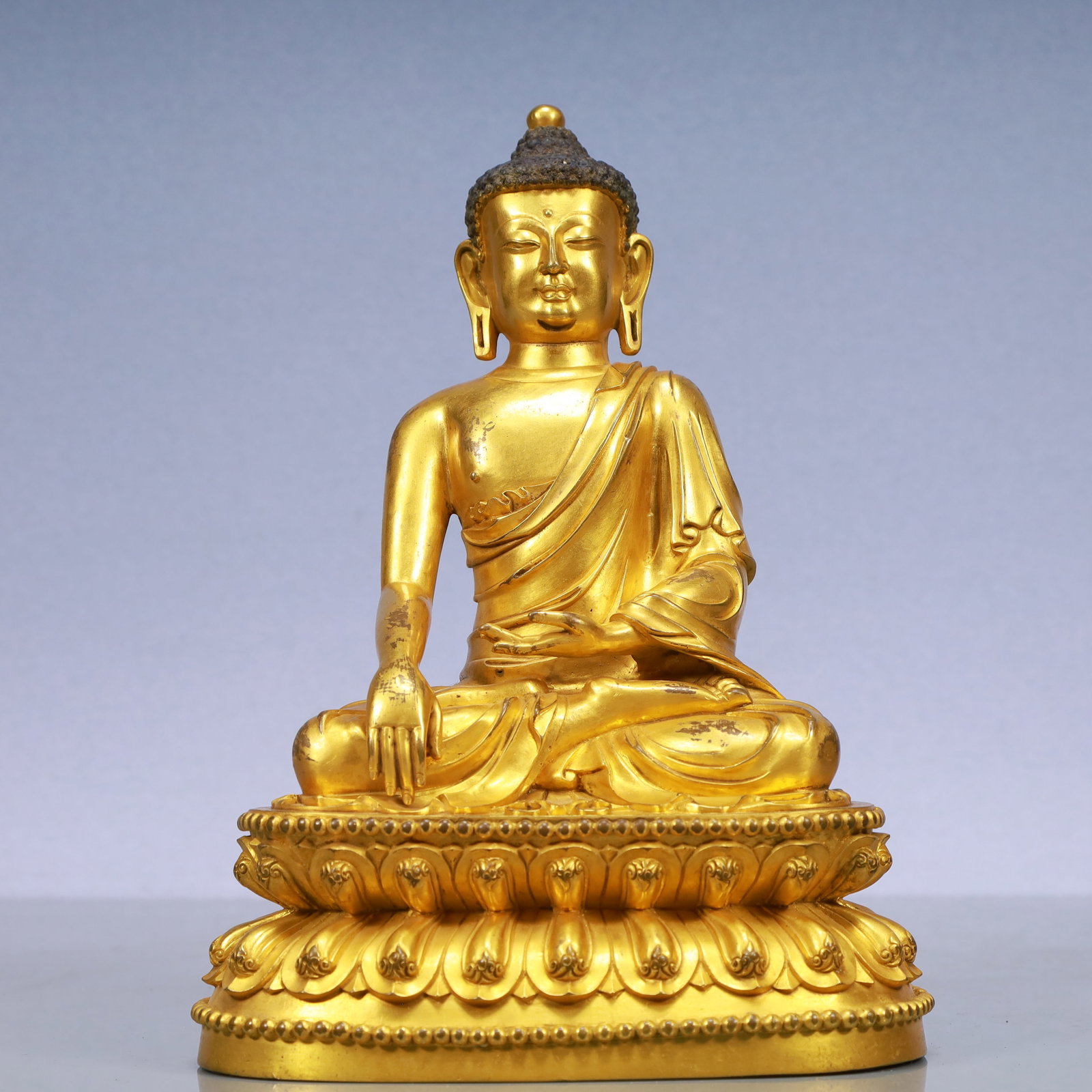 An Exquisite Gilt Bronze Statue of Sakyamuni: An Exquisite Gilt Bronze Statue of Sakyamuni Ming Dynasty, China Yongle Six-character Mark Size:18cmx12cmx25cm Weight:3350g (The Dimensions Of All Batches Are Manually Measured.If You Need More Detail