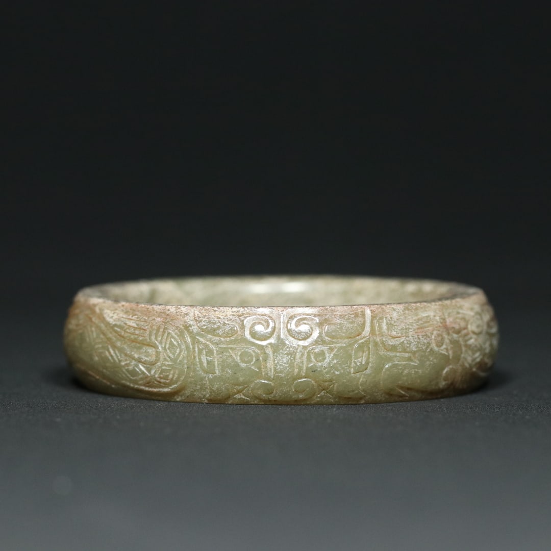 An Exquisite White Jade Beast-Face Pattern Dragon Pattern Bracelets: An Exquisite White Jade Beast-Face Pattern Dragon Pattern Bracelets W.Zhou , China Size:7.9cmx1.7cm Size:(inside diameter)6cm Weight:84.9g (The Dimensions Of All Batches Are Manually Measured.If You N