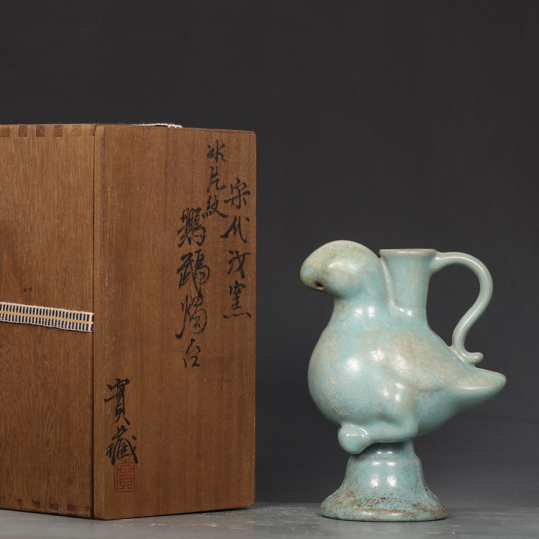 An Exquisite Ru yao Parrot-Shaped Candlestick: An Exquisite Ru yao Parrot-Shaped Candlestick Song Dynasty, China Size:18cmx13.5cm (The Dimensions Of All Batches Are Manually Measured.If You Need More Detailed Information, Please Contact Our
