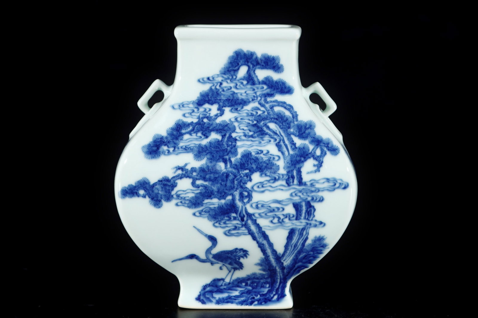An Exquisite Blue and White Pine and Crane Pattern Double-Ears Vase: An Exquisite Blue and White Pine and Crane Pattern Double-Ears Vase Qing Dynasty, China Yongzheng Six-character Mark Size:17.8cmx14.8cm (The Dimensions Of All Batches Are Manually Measured.If You