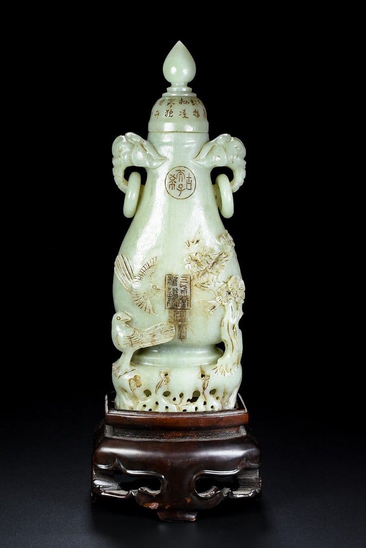 An Exquisite White Jade Flower and Bird Pattern Double-Ears Vase: An Exquisite White Jade Flower and Bird Pattern Double-Ears Vase Qing Dynasty, China Qianlong Four-character Mark Size:25cmx9cmx6cm Weight:590g (The Dimensions Of All Batches Are Manually Measured.If 
