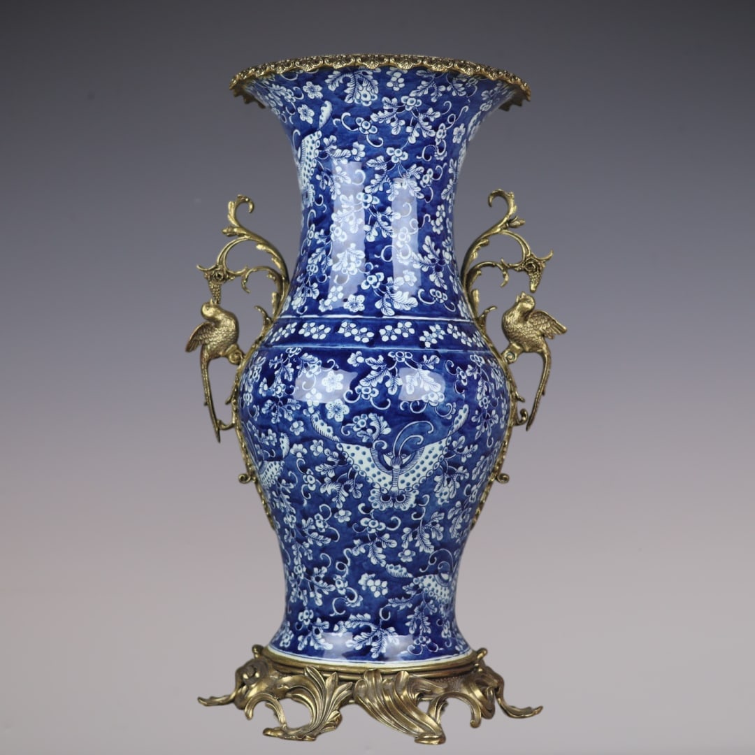 An Exquisite Blue and White Inlaid Bronze Flower and Butterfly Pattern Double-Ears Vase: An Exquisite Blue and White Inlaid Bronze Flower and Butterfly Pattern Double-Ears Vase Qing Dynasty, China Size:55cmx31cm (The Dimensions Of All Batches Are Manually Measured.If You Need More Detaile