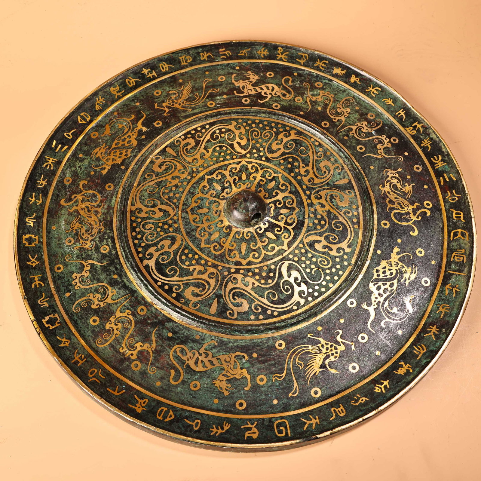 An Exquisite Bronze Inlaid Silver Auspicious Beast Pattern With Inscription Round Mirror: An Exquisite Bronze Inlaid Silver Auspicious Beast Pattern With Inscription Round Mirror Han Dynasty, China Diameter Size:37cmx1cm Weight:3400g (The Dimensions Of All Batches Are Manually Measured.If 