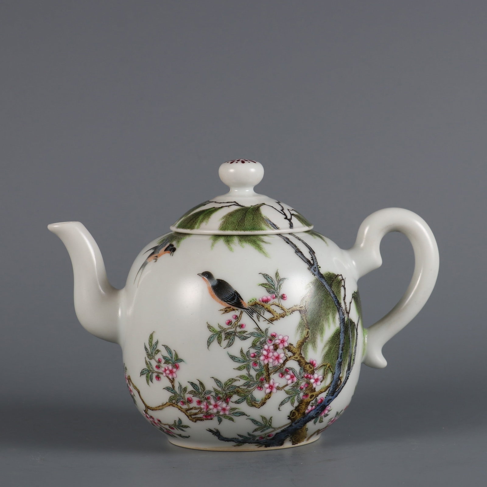 An Exquisite Famille-Rose Flower and Bird Pattern with poem Teapot: An Exquisite Famille-Rose Flower and Bird Pattern with poem Teapot Qing Dynasty, China Qianlong Six-character Mark Size:12.6cmx17cm (The Dimensions Of All Batches Are Manually Measured.If You Need