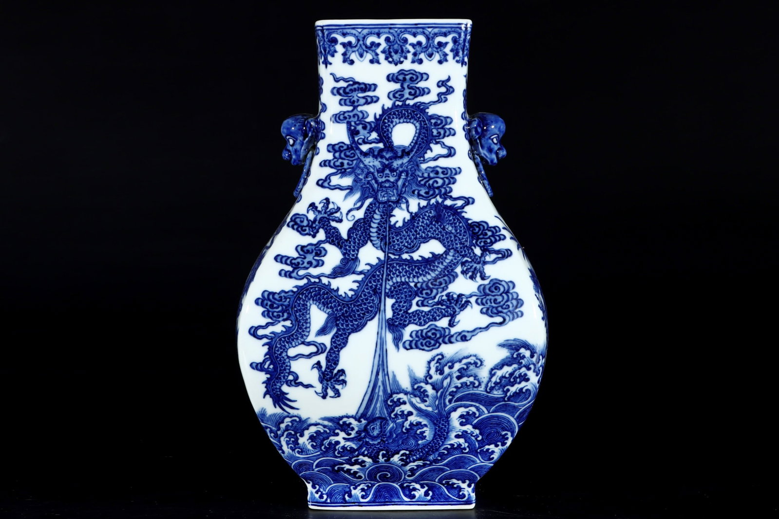 An Exquisite Blue and White Dragon Pattern Seawater Pattern Double-Ears Vase: An Exquisite Blue and White Dragon Pattern Seawater Pattern Double-Ears Vase Qing Dynasty, China Qianlong Six-character Mark Size:30.6cmx19.5cm (The Dimensions Of All Batches Are Manually Measured.If 