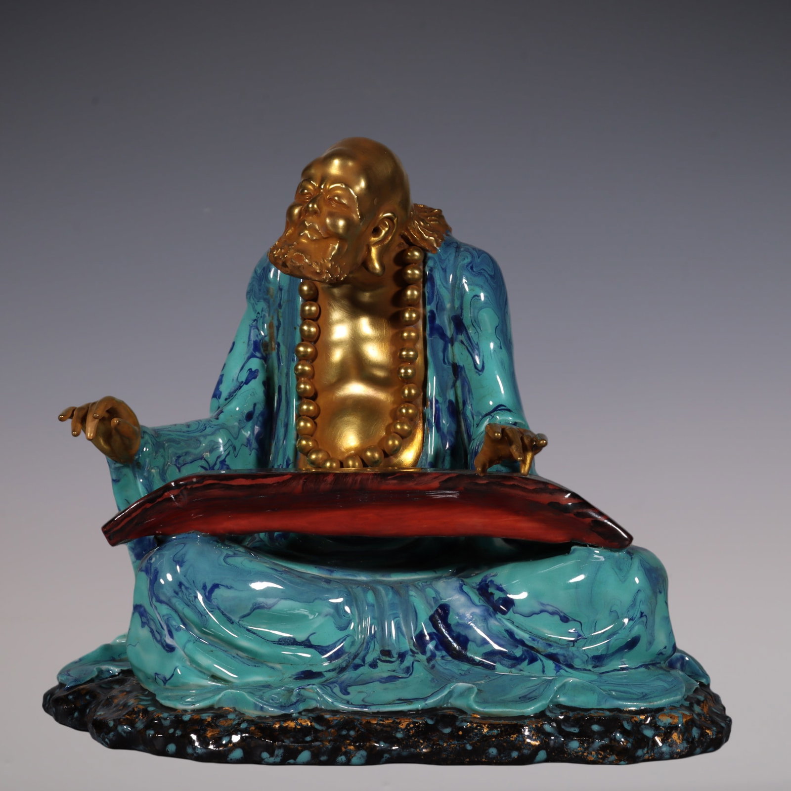 An Exquisite Robin's-Egg-Glazed Painted Gold Statue of Arhat Ornament: An Exquisite Robin's-Egg-Glazed Painted Gold Statue of Arhat Ornament Qing Dynasty, China Qianlong Six-character Mark Size:20cmx22.5cm (The Dimensions Of All Batches Are Manually Measured.If You Need 