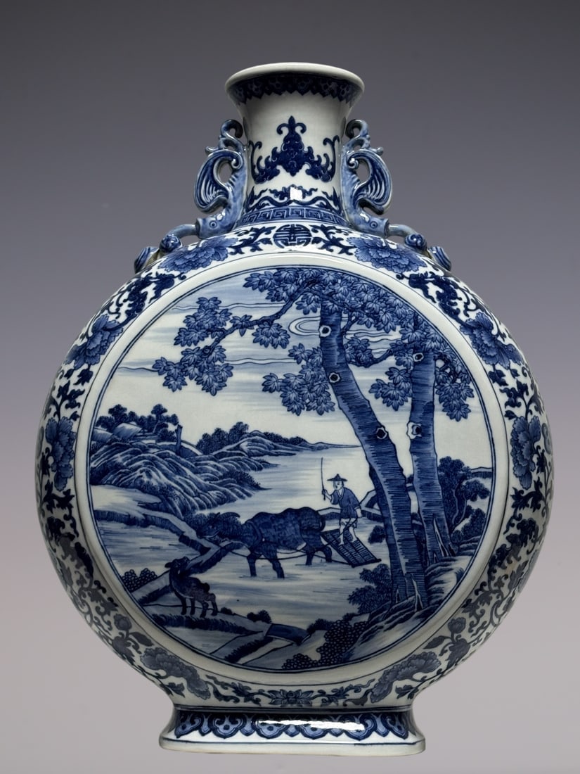 An Exquisite Blue and White Bats and Peach Pattern Lotus Pattern Character and Story Pattern: An Exquisite Blue and White Bats and Peach Pattern Lotus Pattern Character and Story Pattern Double-Ears Vase Qing Dynasty, China Qianlong Six-character Mark Size:59.5cmx45cmx20cm (The Dimensions Of