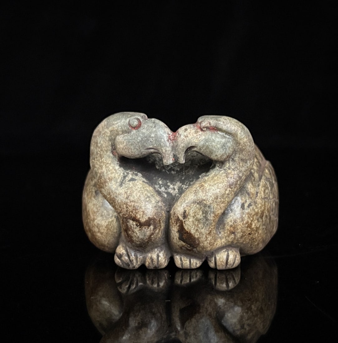 A delicate Han Dynasty Hetian jade of mandarin ducks playing in water: Han dynasty Hetian jade mandarin ducks playing in water SIZE: 5.5x5.6x4.0cm W: 190g (The Dimensions Of All Batches Are Manually Measured.If You Need More Detailed Information, Please Contact Our
