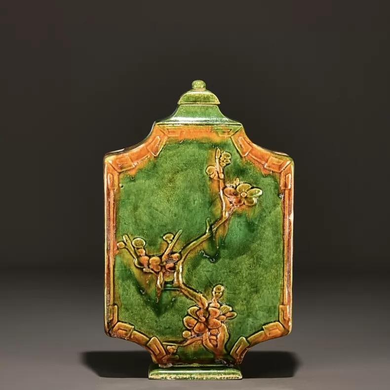 A fine Tang Dynasty three-color carved plum blossom flat teapot: Tang Dynasty three-color carved plum blossom flat teapot SIZE: 27x17cm (The Dimensions Of All Batches Are Manually Measured.If You Need More Detailed Information, Please Contact Our Customer Service B