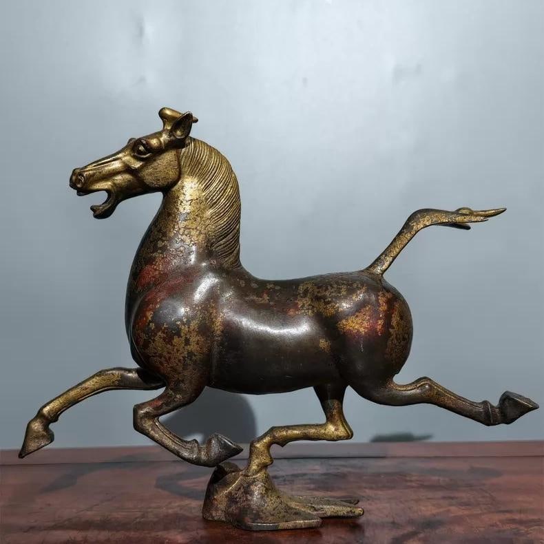 A beautiful late Qing dynasty bronze plaster golden horse strides on flying swallows (1 of 9)