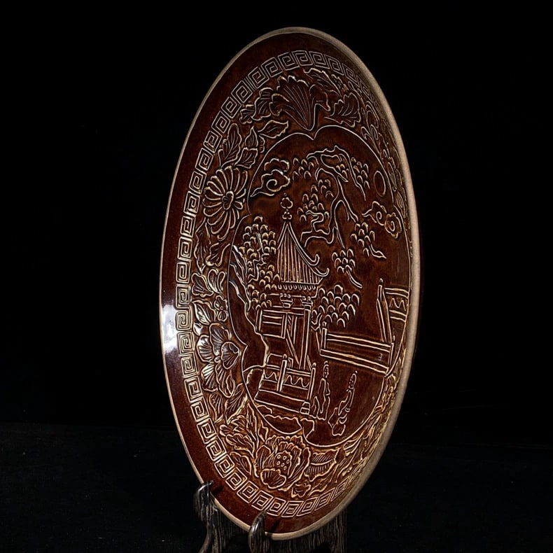 A fine plate with pavilion and tower patterns from Song Dynasty Ding kiln sauce-glazed sauce: Song Dynasty Ding kiln sauce-glazed pavilion and tower pattern plate SIZE: 7x34cm (The Dimensions Of All Batches Are Manually Measured.If You Need More Detailed Information, Please Contact Our Custome