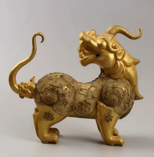 A fine Tang Dynasty unicorn with beads and gilt on a copper background: Tang Dynasty: Unicorn with a copper base adorned with beads and gilded SIZE: 21x8x18cm W:578g (The Dimensions Of All Batches Are Manually Measured.If You Need More Detailed Information, Please Contact