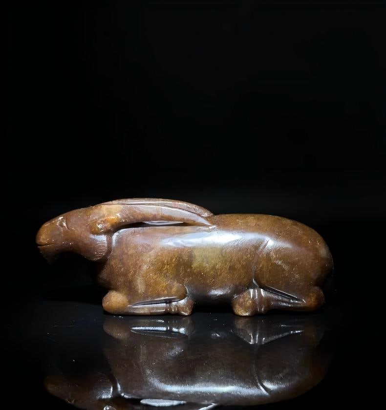 A beautiful ancient Han dynasty jade goat-shaped ornament: An ancient Han dynasty jade sheep-shaped ornament SIZE: approx. 9.1x2.9cm W: approx. 175g (The Dimensions Of All Batches Are Manually Measured.If You Need More Detailed Information, Please Contact Our