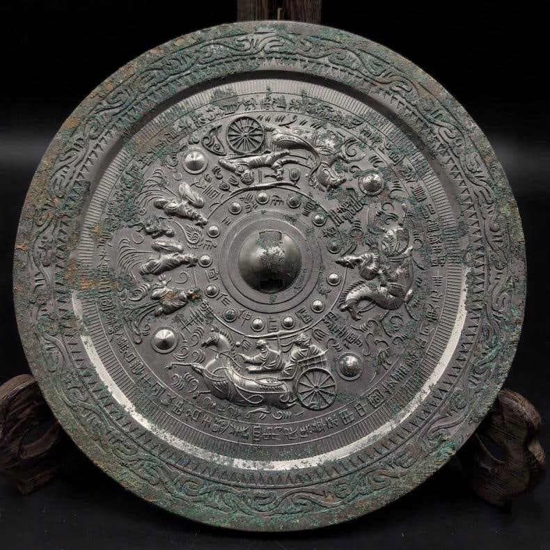 A fine bronze mirror depicting a Han dynasty Zhaojun descending the frontier with a figure motif: A bronze mirror featuring figures from Zhaojun's journey beyond the frontier from the Han dynasty SIZE: D: Approximately 20cm (The Dimensions Of All Batches Are Manually Measured.If You Need More Deta