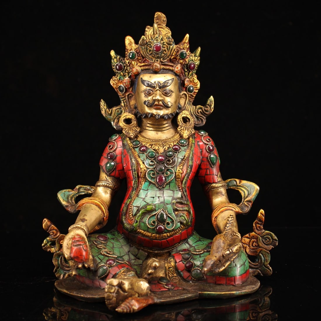 A finely crafted Qing Dynasty gem-inlaid painted gold depiction of the God of Wealth (1 of 9)