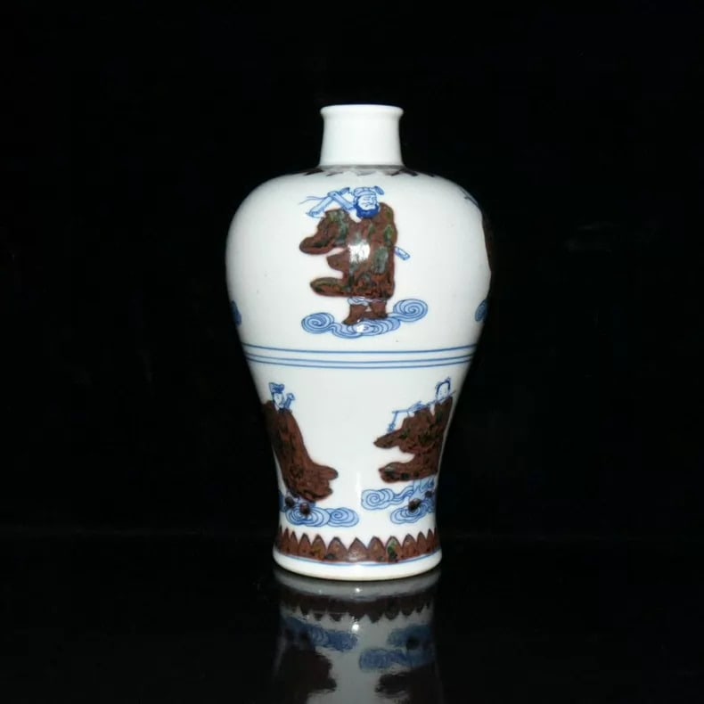 A fine Qing Dynasty Kangxi blue-and-white underglaze red Baxian plum vase: Qing Dynasty Kangxi blue-and-white underglaze red Eight Immortals plum vase SIZE: 19x11.5cm (The Dimensions Of All Batches Are Manually Measured.If You Need More Detailed Information, Please Contact O