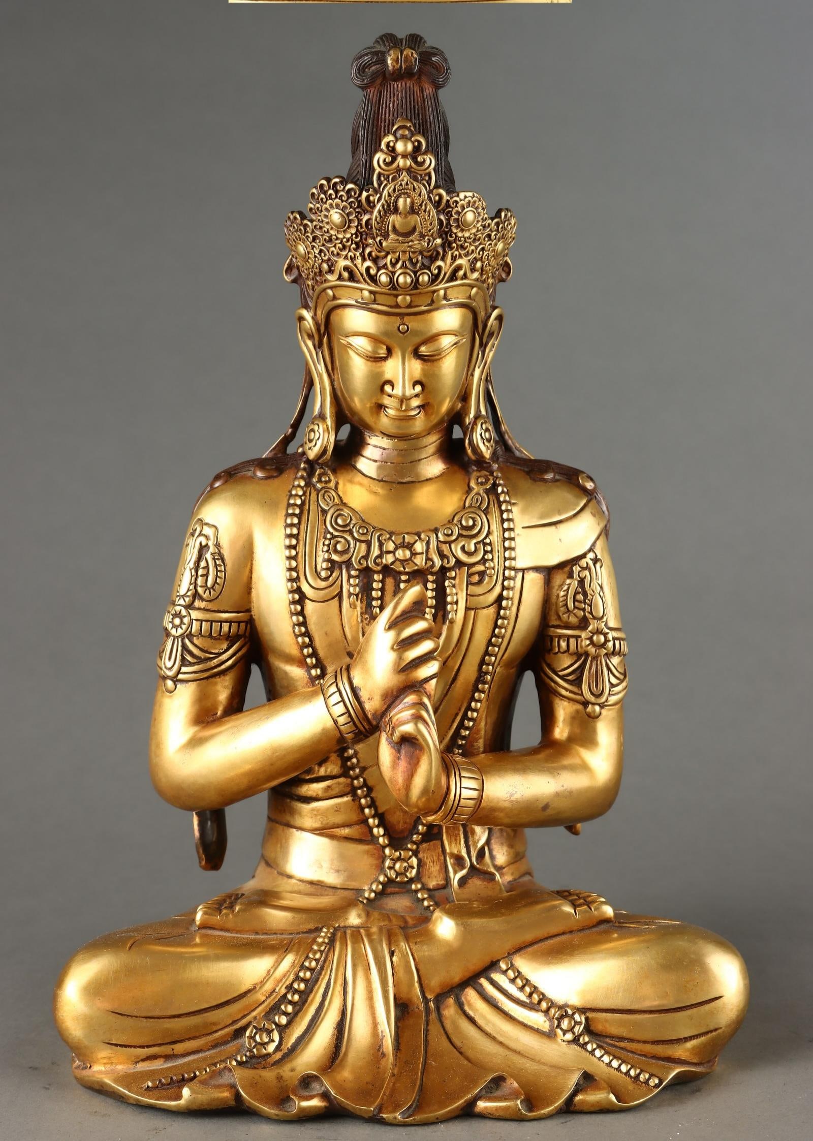 A beautiful Ming Dynasty bronze-plated gilt seated Vairocana Buddha: Ming Dynasty gilded bronze seated statue of Mahavairocana Buddha SIZE: H:31.5cm W:21cm W:6kg (The Dimensions Of All Batches Are Manually Measured.If You Need More Detailed Information, Please Contact 