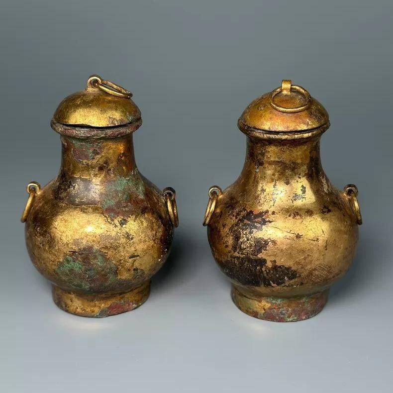 A fine Tang Dynasty bronze gilded small round vase: A small gilded bronze round vase from the Tang Dynasty SIZE: D:5.5cm H:8.8cm (The Dimensions Of All Batches Are Manually Measured.If You Need More Detailed Information, Please Contact Our Customer Ser