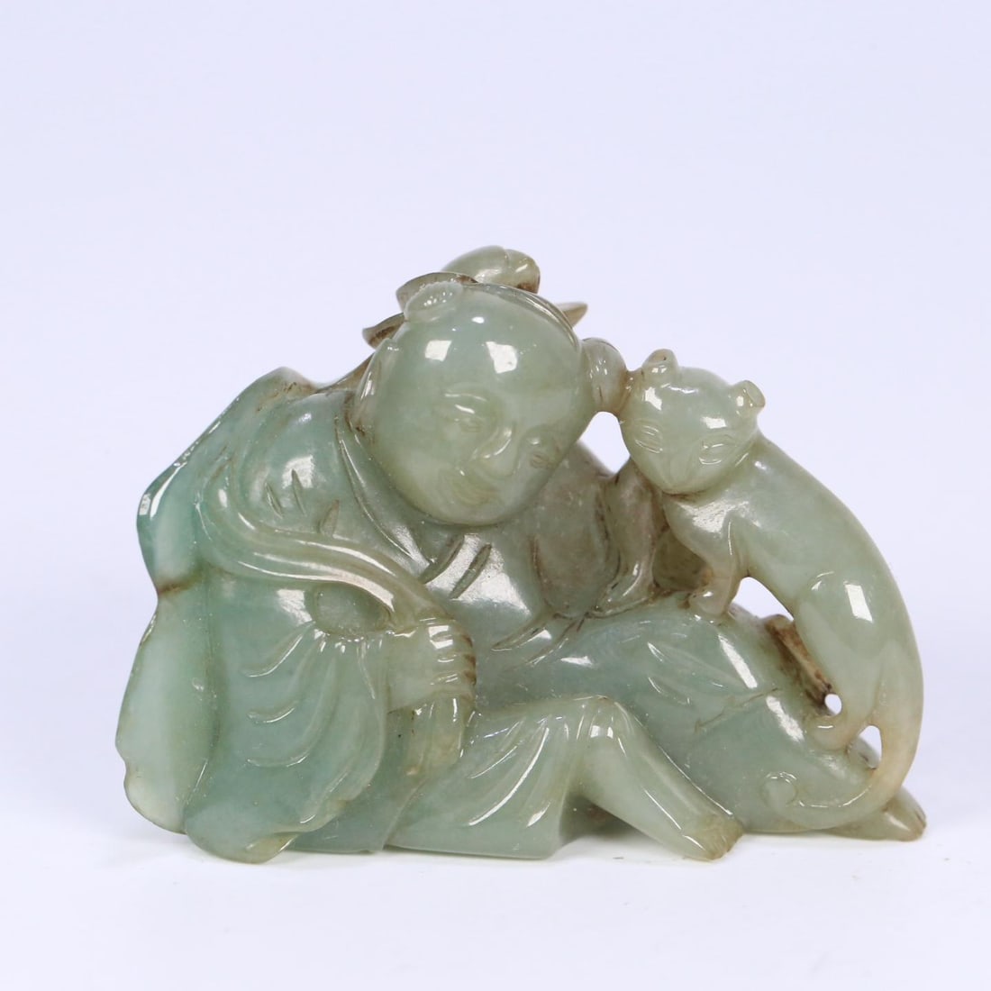A fine Qing Dynasty jadeite carving of a lotus child holding a lotus: Qing Dynasty Jadeite Lotus Child Carving SIZE: 5.7x2.3x4cm W:64g (The Dimensions Of All Batches Are Manually Measured.If You Need More Detailed Information, Please Contact Our Customer Service Before 