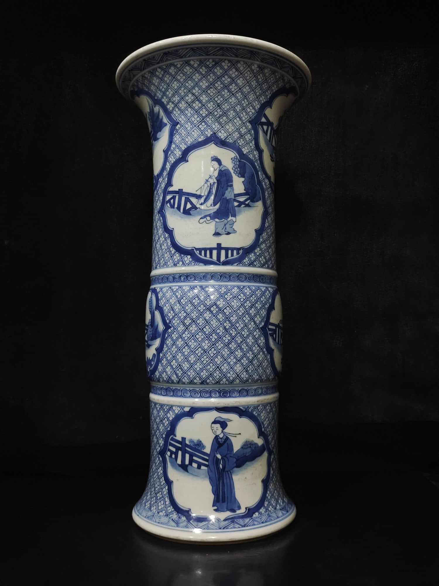A fine Qing Dynasty blue-and-white window figure flower drum: Qing dynasty blue-and-white window flower drum SIZE: H:47cm W:15cm (The Dimensions Of All Batches Are Manually Measured.If You Need More Detailed Information, Please Contact Our Customer Service Befor