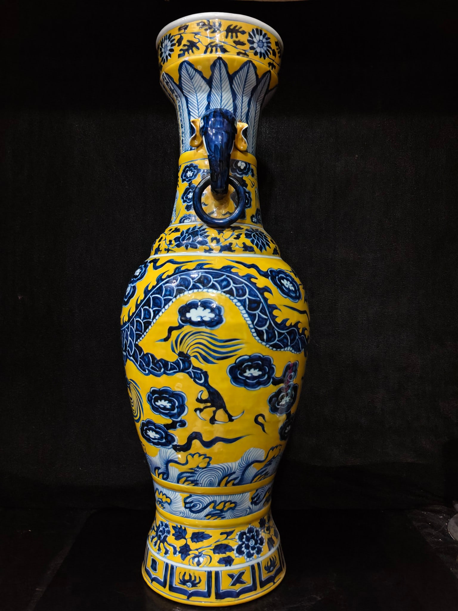 A fine yellow-glazed blue-and-white elephant-ear vase with cloud and dragon motifs made during the: A yellow-glazed blue-and-white elephant-ear vase with cloud and dragon motifs made during the Zhizheng period of the Yuan Dynasty SIZE: H:62cm W:20cm (The Dimensions Of All Batches Are Manually Measur