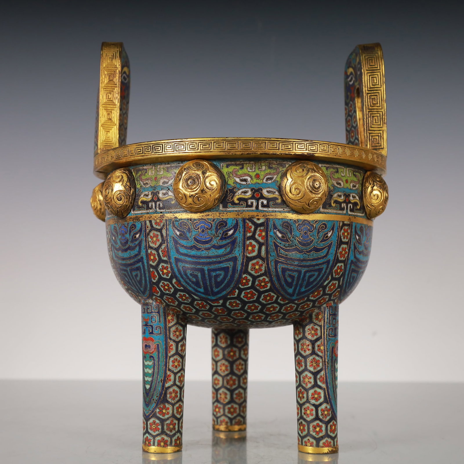 An Exquisite Cloisonne Gilt Bronze Lotus Pattern Double-Ears Tripod Censer: An Exquisite Cloisonne Gilt Bronze Lotus Pattern Double-Ears Tripod Censer Qing Dynasty, China Qianlong Four-character MarkSize:19cmx19cmx25.5cm Weight:1500g (The Dimensions Of All Batches Are