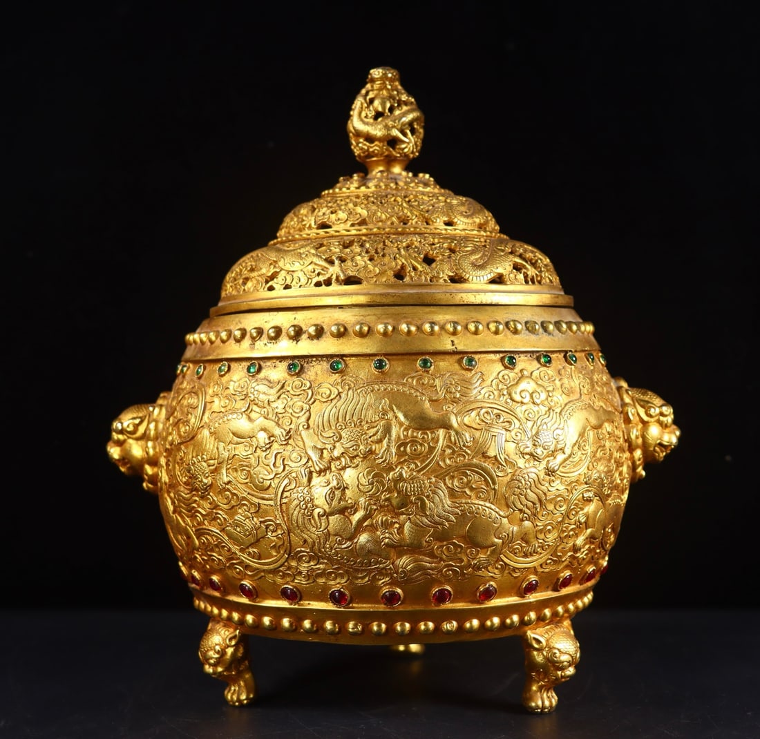 An Exquisite Gilt Bronze Inlaid Gems Lion Pattern Double-Ears Tripod Censer: An Exquisite Gilt Bronze Inlaid Gems Lion Pattern Double-Ears Tripod Censer Qing Dynasty, China Qianlong Four-character Mark Size: 26.5cmx22cmx17cm Weight:3780g (The Dimensions Of All Batches Are