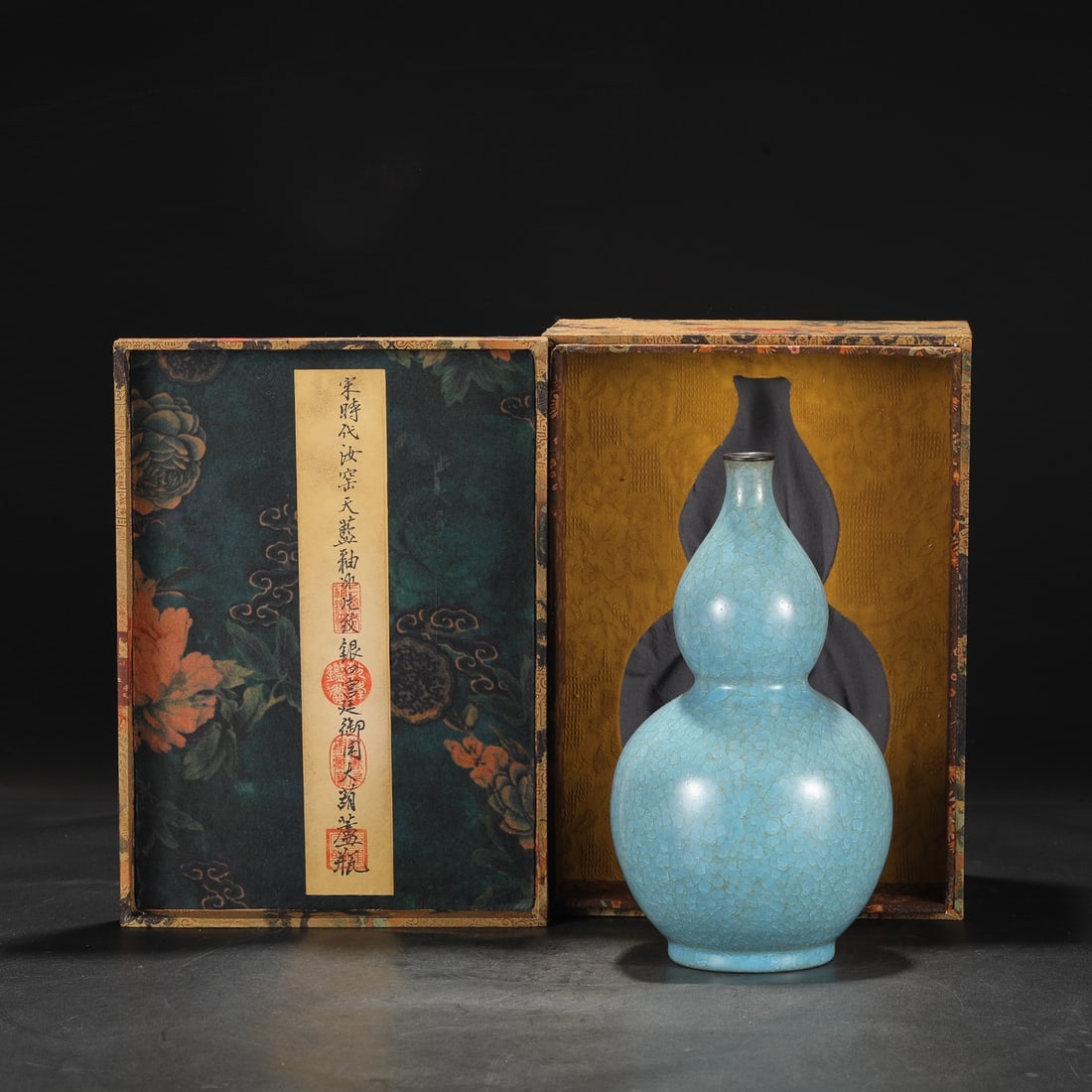 An Exquisite Ru yao Gourd-Shaped Vase: An Exquisite Ru yao Gourd-Shaped Vase Song Dynasty, China Size:28cmx14cm (The Dimensions Of All Batches Are Manually Measured.If You Need More Detailed Information, Please Contact Our Customer