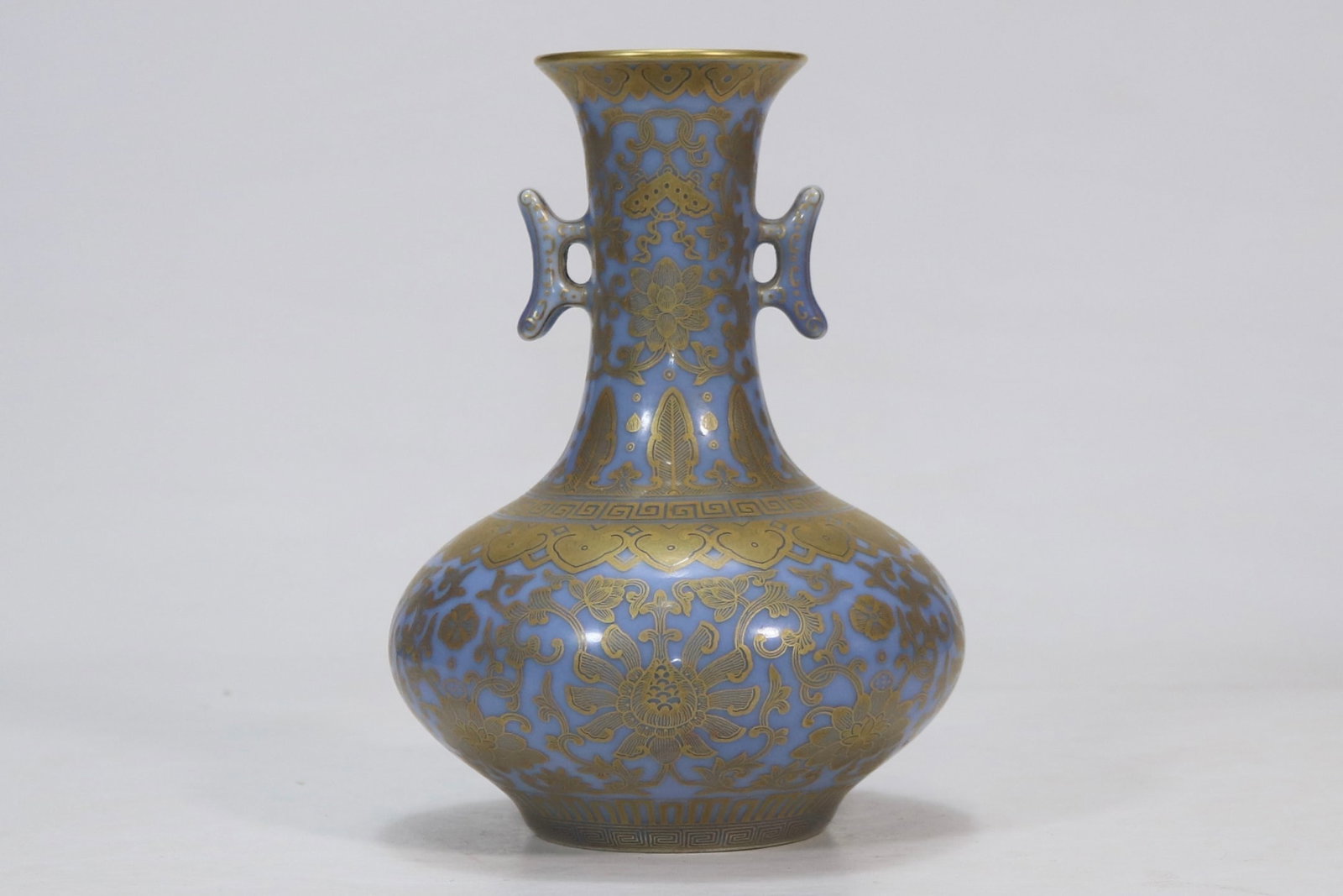 An Exquisite Blue Glazed Painted Gold Lotus Pattern Double-Ears Vase: An Exquisite Blue Glazed Painted Gold Lotus Pattern Double-Ears Vase Qing Dynasty, China Qianlong Six-character Mark Size:19.3cmx6.8cm (The Dimensions Of All Batches Are Manually Measured.If You Need