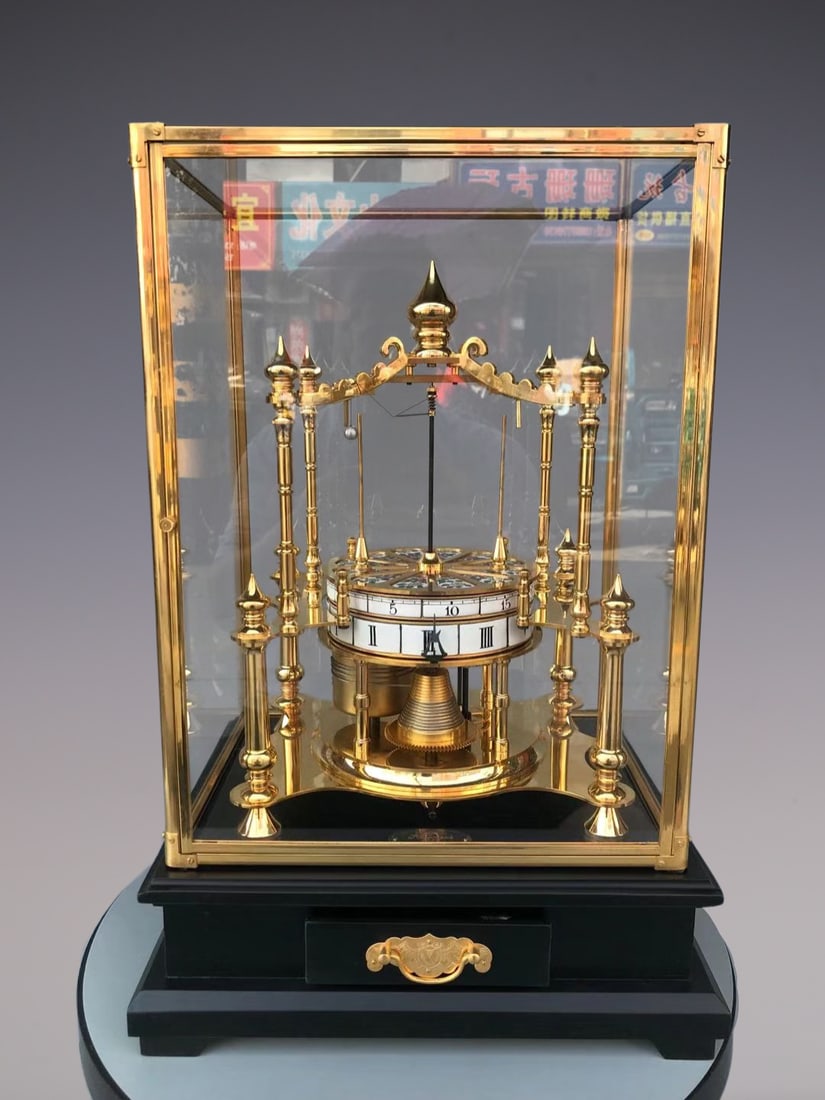 An Exquisite Gilt Bronze Lotus Pattern Clock: An Exquisite Gilt Bronze Lotus Pattern Clock Qing Dynasty, China Size:52cmx34cmx27cm (The Dimensions Of All Batches Are Manually Measured.If You Need More Detailed Information, Please Contact Our Cust