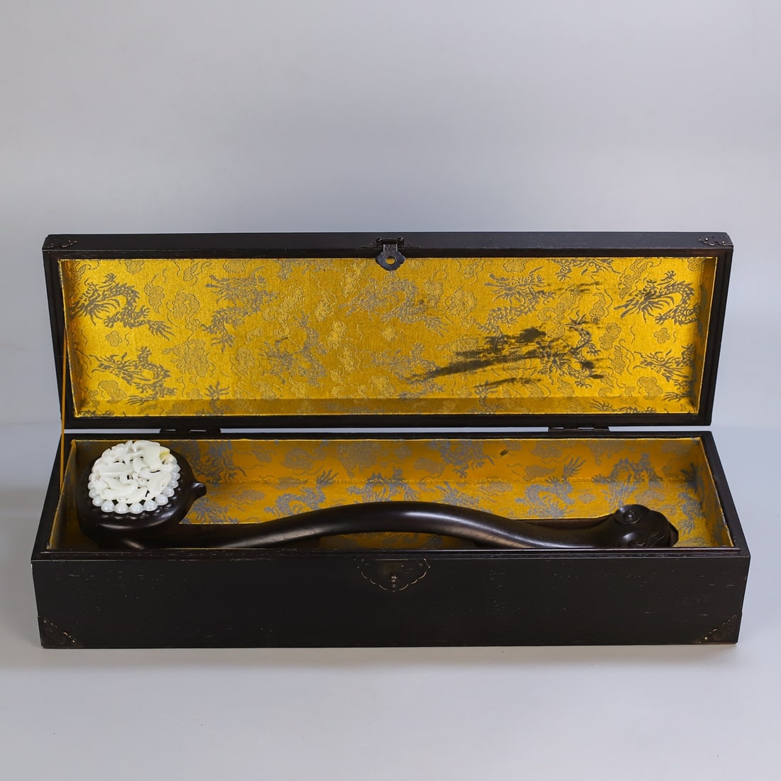 An Exquisite Zitanwood Inlaid White Jade Flower and Bird Pattern Ruyi: An Exquisite Zitanwood Inlaid White Jade Flower and Bird Pattern Ruyi Qing Dynasty, China Size:13cmx54cm Weight:450g Size:47cmx12cm Weight:2605g (The Dimensions Of All Batches Are Manually