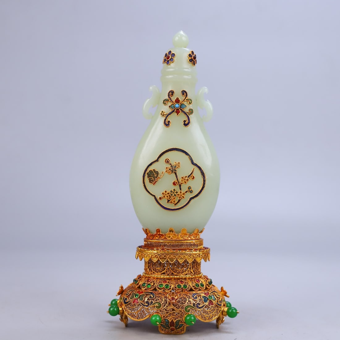 An Exquisite Gilt Bronze Inlaid White Jade Flower and Butterfly Pattern Vase: An Exquisite Gilt Bronze Inlaid White Jade Flower and Butterfly Pattern Vase Qing Dynasty, China Qianlong Four-character Mark Size:24cmx11cm Weight:380g (The Dimensions Of All Batches Are Manually