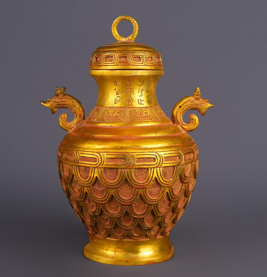 An Exquisite Gilt Bronze With Inscription Double-Ears Vase: An Exquisite Gilt Bronze With Inscription Double-Ears Vase Han Dynasty, China Size:21cmx29cm Weight:2150g (The Dimensions Of All Batches Are Manually Measured.If You Need More Detailed Information,