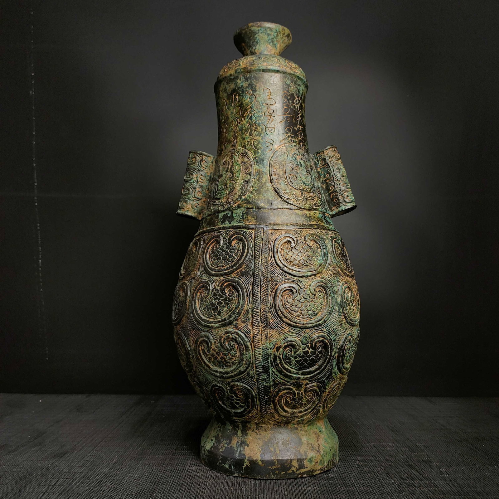 An Exquisite Bronze With Inscription Phoenix Pattern Double-Ears Vase: An Exquisite Bronze With Inscription Phoenix Pattern Double-Ears Vase N.Zhou , China Size:41cmx19cm Weight:4.5kg (The Dimensions Of All Batches Are Manually Measured.If You Need More Detailed