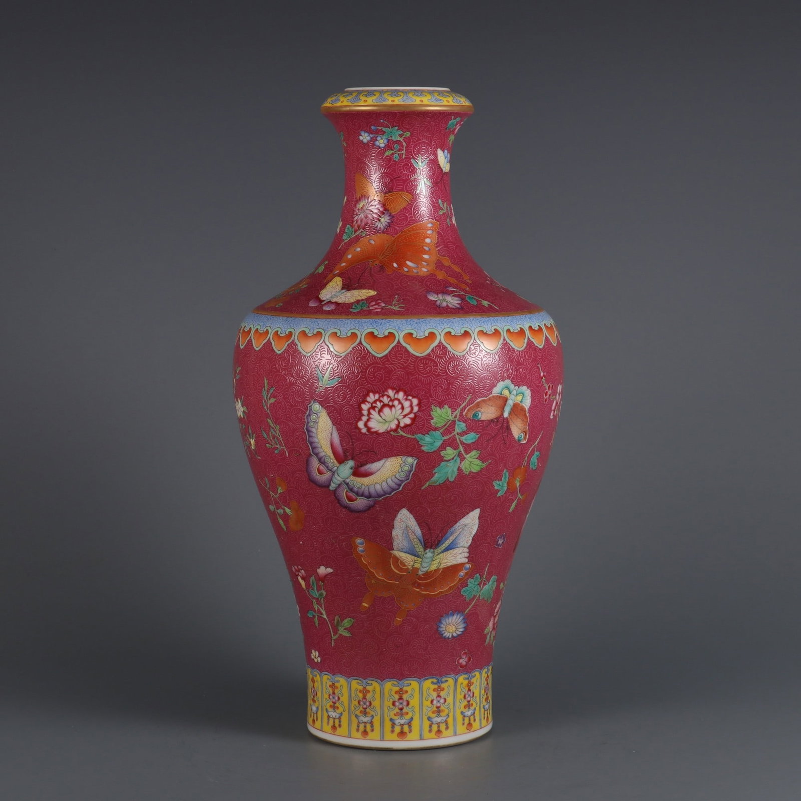An Exquisite Famille-Rose Ruby Red-Glazed Flower and Butterfly Pattern Vase: An Exquisite Famille-Rose Ruby Red-Glazed Flower and Butterfly Pattern Vase Qing Dynasty, China Qianlong Six-character Mark Size:32.8cmx16cm (The Dimensions Of All Batches Are Manually Measured.If You