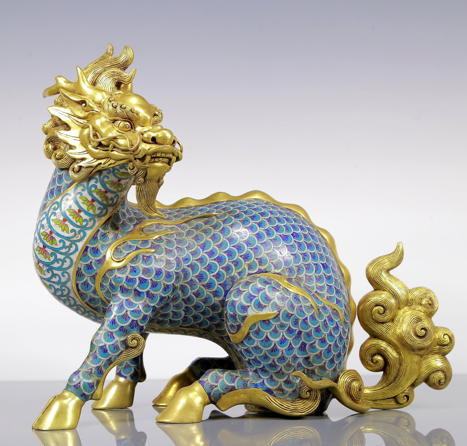 An Exquisite Gilt Bronze Cloisonne Kylin Ornament: An Exquisite Gilt Bronze Cloisonne Kylin Ornament Qing Dynasty, China Qianlong Four-character Mark Size:37cmx17cmx35cm Weight:8625g (The Dimensions Of All Batches Are Manually Measured.If You Need