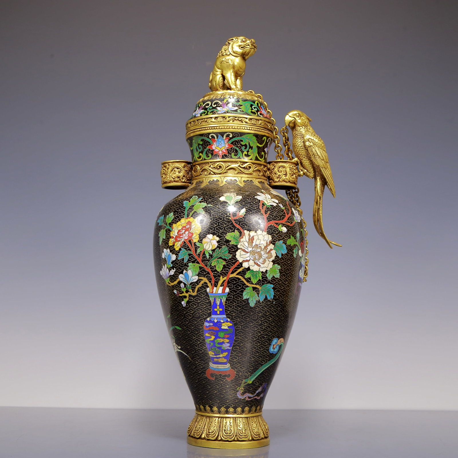 An Exquisite Gilt Bronze Cloisonne Flower and Bird Pattern Vase: An Exquisite Gilt Bronze Cloisonne Flower and Bird Pattern Vase Qing Dynasty, China Qianlong Four-character Mark Size:21cmx16cmx49cm Weight:6280g (The Dimensions Of All Batches Are Manually