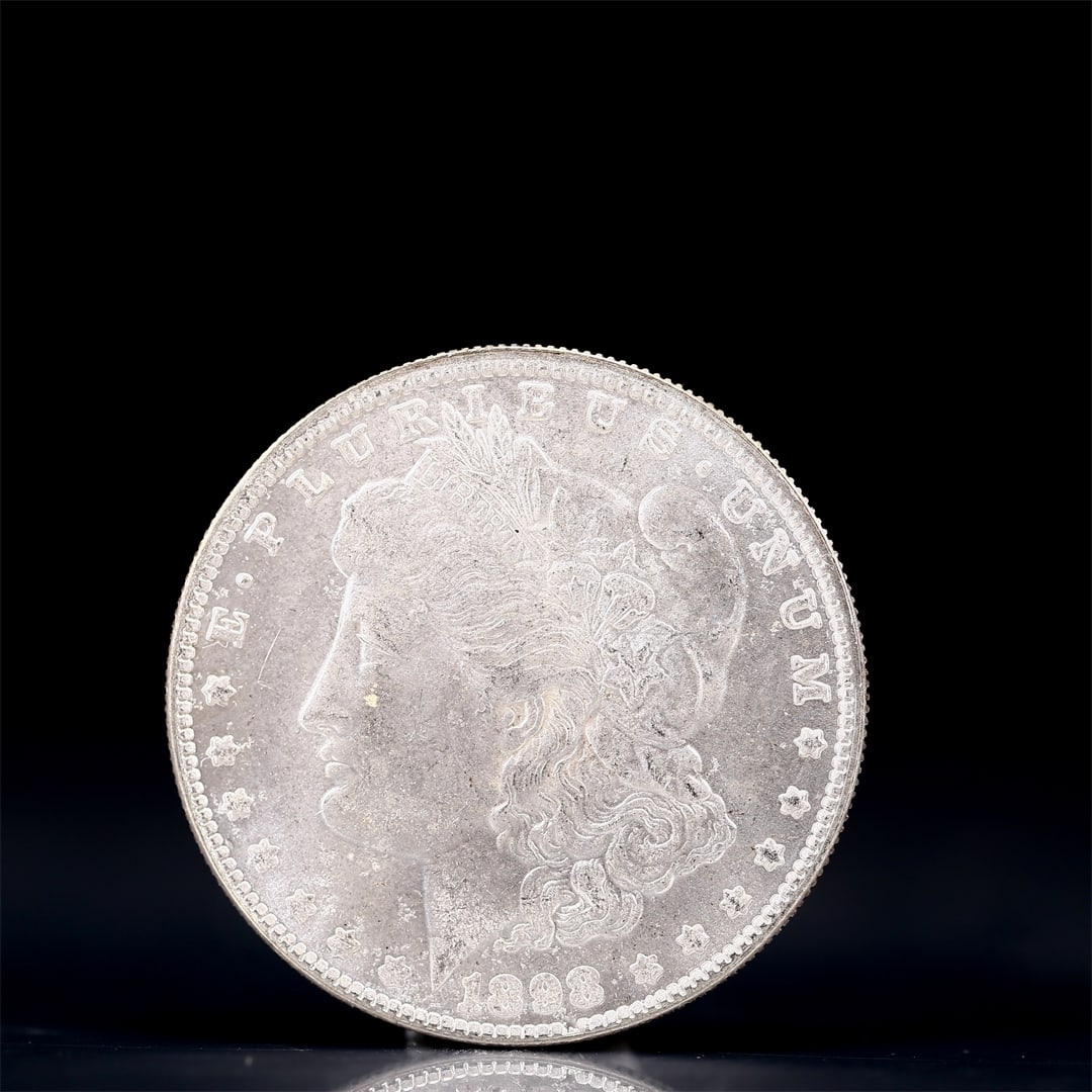 USA Morgan Dollar 1898 Coin: Obv: profile bust with date below and E PLURIBUS UNUM legend and stars around. Rev: eagle with In God we trust above within wreath with UNITED STATES OF AMERICA ONE DOLLAR legend. IN GOD WE TRUST /