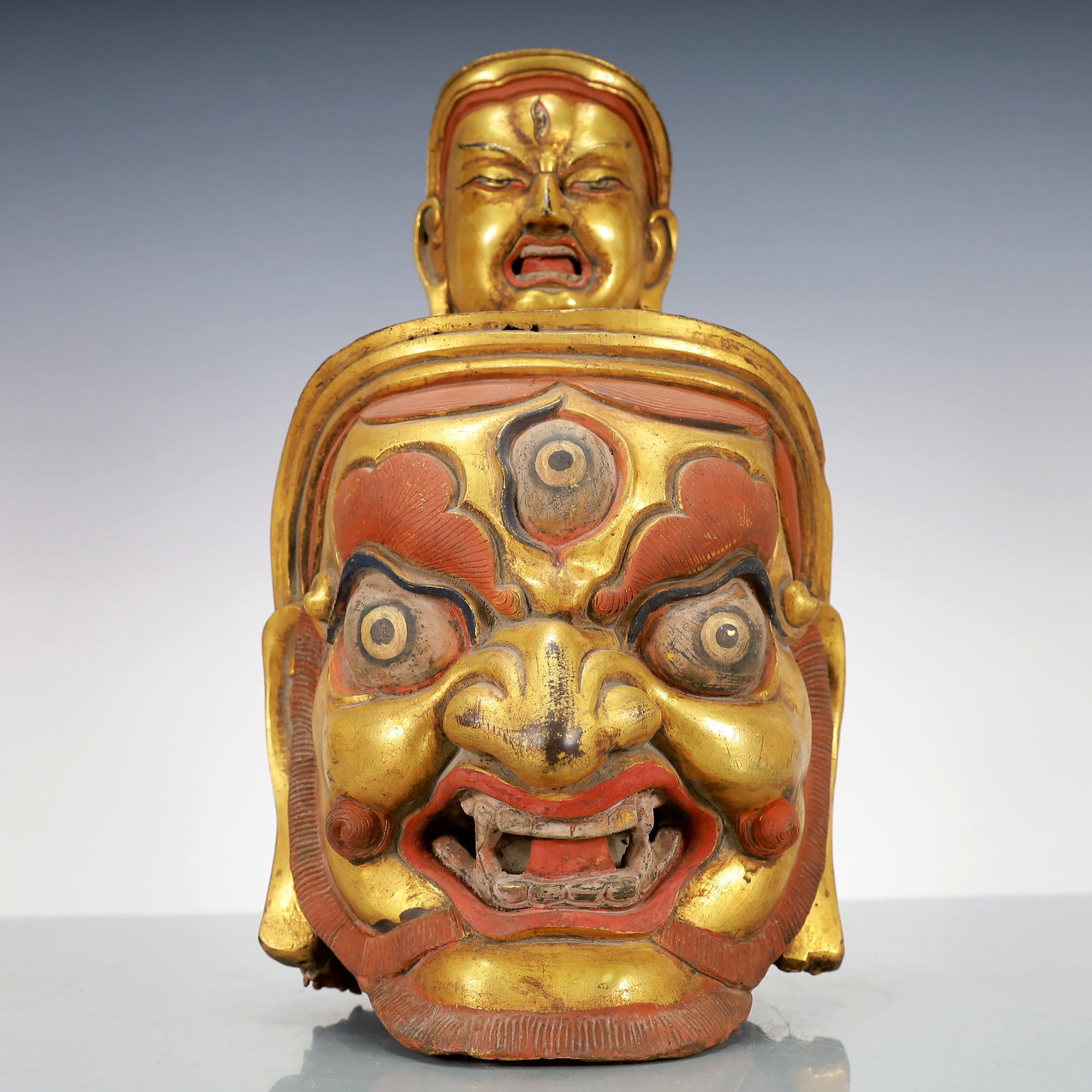 A Exquisite Gilt Bronze Buddha head: A Exquisite Gilt Bronze Buddha head Qing Dynasty, China Size:18cmx19cmx34cm Weight:5850g (The Dimensions Of All Batches Are Manually Measured.If You Need More Detailed Information, Please Contact Our