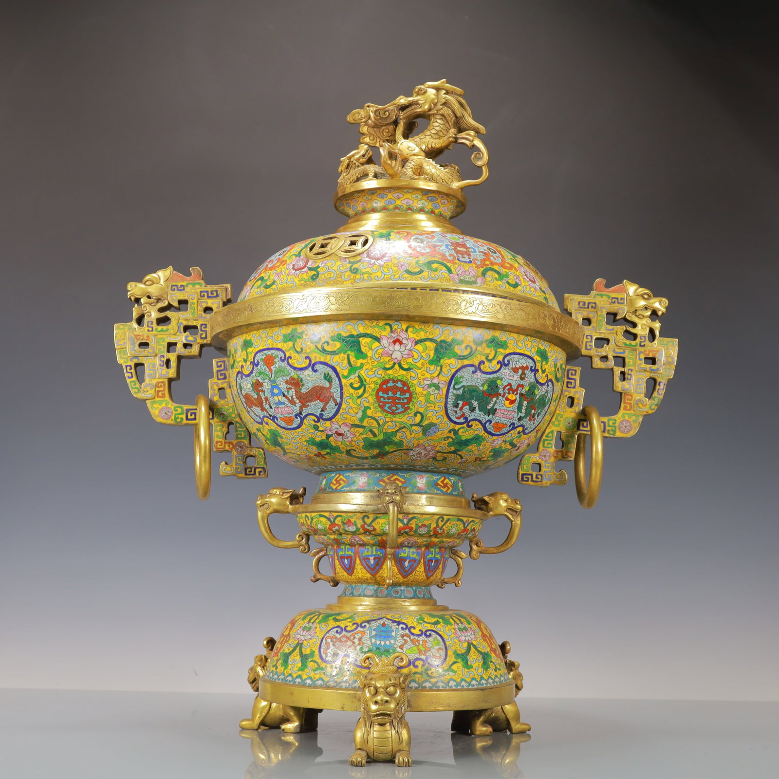 A Exquisite Cloisonne Lotus Pattern Auspicious Beast Pattern Double-Ears and Tripod Censer: A Exquisite Cloisonne Lotus Pattern Auspicious Beast Pattern Double-Ears and Tripod Censer Qing Dynasty, China Qianlong Six-character Mark Size:66.5cmx54cm Weight:28900g (The Dimensions Of All