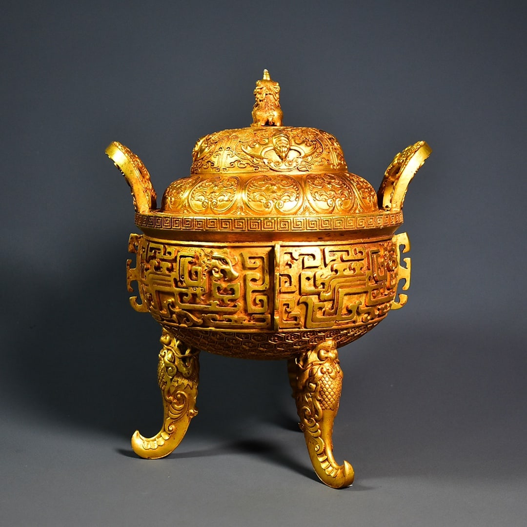 An Exquisite Gilt Bronze Double-Ears and Tripod Censer: An Exquisite Gilt Bronze Double-Ears and Tripod Censer Qing Dynasty, China Size:28cmx23cm Weight:3555g (The Dimensions Of All Batches Are Manually Measured.If You Need More Detailed Information,