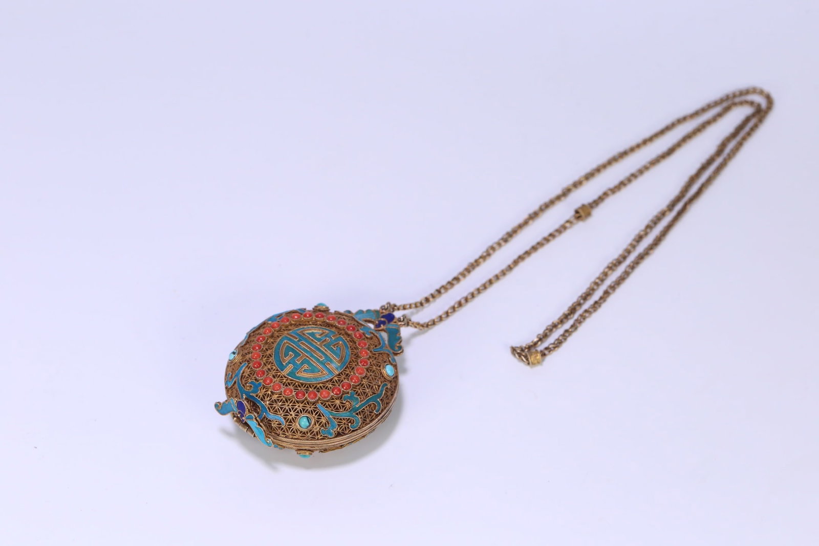 An Exquisite Gilt Silver Inlaid Turquoise Bats and Peach Pattern Pendant: An Exquisite Gilt Silver Inlaid Turquoise Bats and Peach Pattern Pendant Qing Dynasty, China Size:45cmx6.1cmx3.1cm Weight:93g (The Dimensions Of All Batches Are Manually Measured.If You Need More